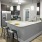 Barstool seating around open, kitchen countertop with pendant lighting at The Laurent at Carolina Forest