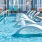 In-pool lounge chairs on sun shelf in pool at The Laurent at Carolina Forest