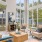 Oversized windows surround seating area in clubhouse at The Laurent at Carolina Forest