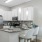 Breakfast bar with pendant lights over open countertops in apartment kitchen at The Laurent at Carolina Forest