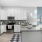 C-shaped kitchen with open countertop facing living room in apartments at The Laurent at Carolina Forest