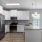 Pendant lights over kitchen countertop in apartments at The Laurent at Carolina Forest