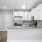 Breakfast bar in apartment kitchen with bright lighting at The Laurent at Carolina Forest